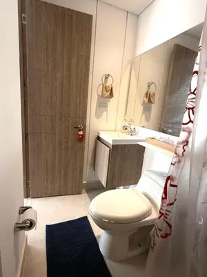a bathroom with a toilet and a sink at Serena del Mar in Cartagena de Indias