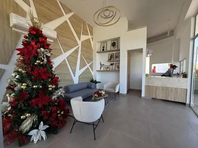 a christmas tree in the middle of a lobby at Serena del Mar in Cartagena de Indias