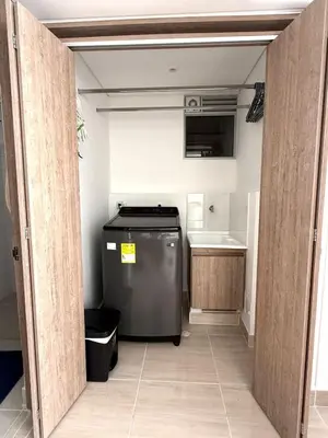 a small kitchen with a refrigerator in a room at Serena del Mar in Cartagena de Indias