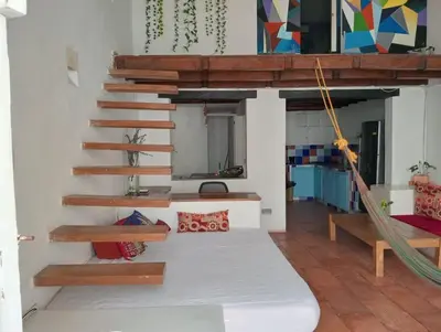 a room with a bed and a hammock in it at Cozy apartment Old City in Cartagena de Indias