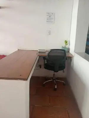 a desk in a corner with a chair in a room at Cozy apartment Old City in Cartagena de Indias
