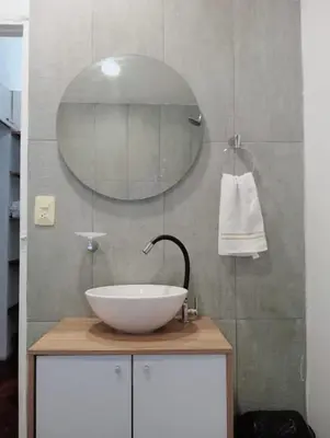 a bathroom with a white sink and a mirror at Cozy apartment Old City in Cartagena de Indias