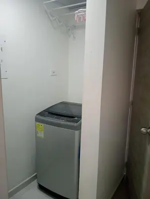 a small trash can in a corner of a room at Modern & Cozy Apartment Near the Beach in Cartagena de Indias