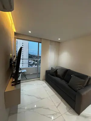 a living room with a couch and a television at Apt 2605 in Cartagena de Indias