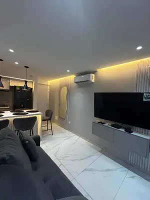 a living room with a large flat screen tv on a wall at Apt 2605 in Cartagena de Indias
