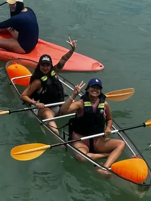 two women in a kayak in the water at Costa Azul Isla Fuerte in Isla Fuerte