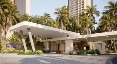 a building with a car parked in front of it at Nuevo Loft santa Marta vista al mar piso 18 in Santa Marta