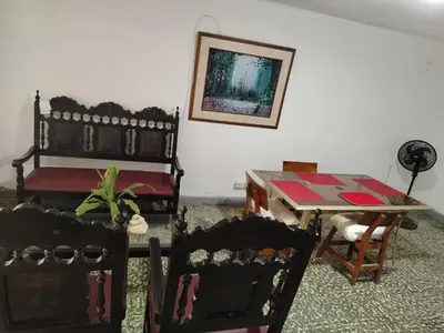 a room with a table and chairs and a table and a table and chairs at Entire house in Cartagena in Cartagena de Indias
