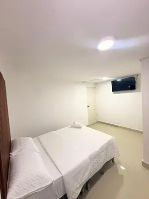 a hospital room with a bed and a tv at Hotel CARTAGENA ES in Cartagena de Indias