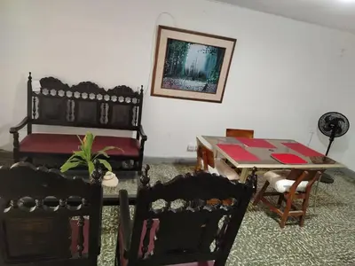 a room with a table and chairs and a table and a table and chairs at Apt at the foot of the stern in Cartagena de Indias