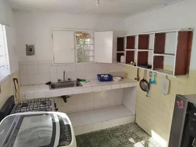a small kitchen with a sink and a sink at Apt at the foot of the stern in Cartagena de Indias