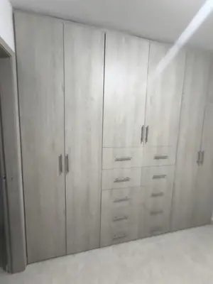 a closet with wooden cabinets in a room at cartagena luxury in Cartagena de Indias