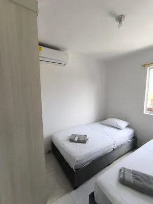 a bedroom with two beds and a window at cartagena luxury in Cartagena de Indias