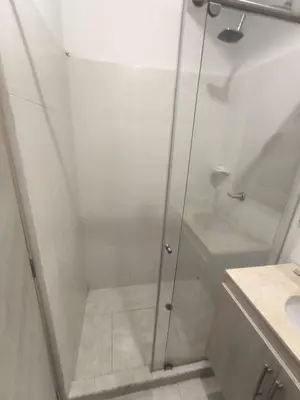 a shower with a glass door next to a sink at cartagena luxury in Cartagena de Indias