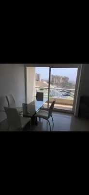 a room with a table and chairs and a window at Apartamento entero en Miramar, Barranquilla Norte in Barranquilla