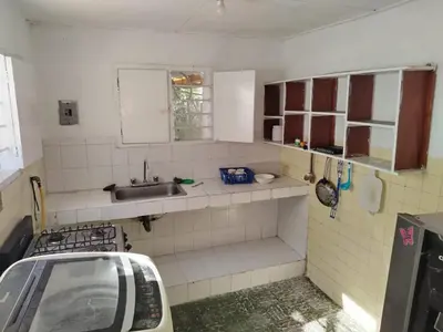 a small kitchen with a sink and a counter top at Cartagena, full house in Cartagena de Indias