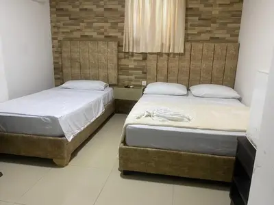 two beds in a room with two beds sidx sidx sidx at Hotel Avanty Barranquilla in Barranquilla