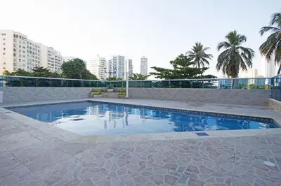 a swimming pool in a city with tall buildings at Riviera Loft - Apartamento con vista al mar in Cartagena de Indias