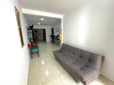 a living room with a couch and a table and chairs at Habitación con baño privado cerca del carnaval de Barranquilla in Barranquilla