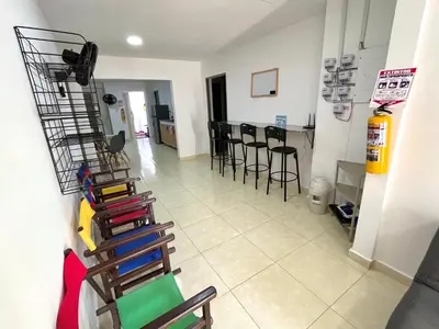 a view of a room with chairs and a table at Habitación con baño privado cerca del carnaval de Barranquilla in Barranquilla