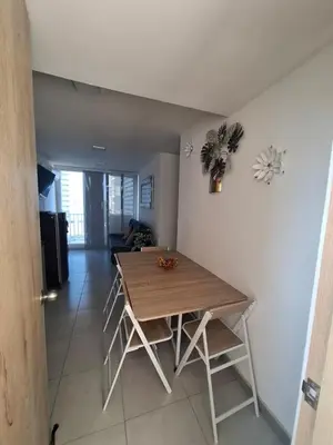 a dining room table and chairs in a room at Apartamento en cartagena vista al mar in Cartagena de Indias