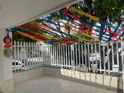 a white fence with a bunch of streamers on it at The best room in Barranquilla! in Barranquilla
