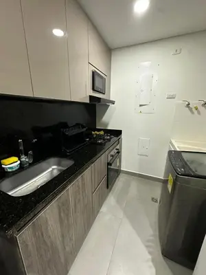 a kitchen with a sink and a counter top at Beautiful, apartment near CC Único, Estadio R Martinez in Barranquilla