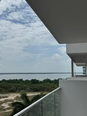 a view of the ocean from the balcony of a house at Cartagena Cielo Mar Apartment Steps from the Beach in Cartagena de Indias