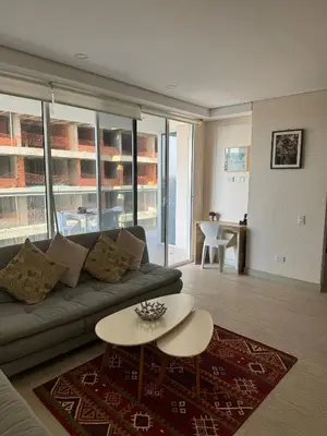 a living room with a couch and a table at Cartagena Cielo Mar Apartment Steps from the Beach in Cartagena de Indias