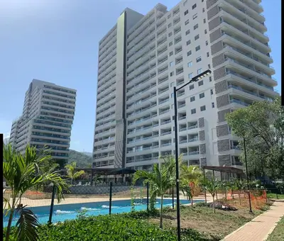 two tall buildings next to a swimming pool at Loft Premium con Vista al Mar in Santa Marta