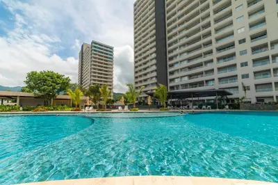 a large swimming pool in front of tall buildings at Loft Premium con Vista al Mar in Santa Marta