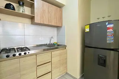 a kitchen with a stainless steel refrigerator and a sink at Apartamento cómodo, ubicación excelente in Barranquilla