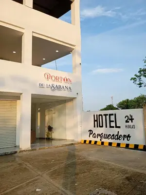 a hotel sign on the side of a building at Hotel Portón de La Sabana in San Onofre