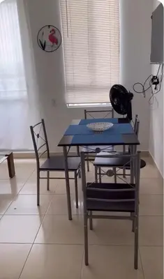 a blue table and chairs in a room at Modern and renowned apartment in Cartagena in Cartagena de Indias