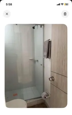 a bathroom with a glass shower with a toilet at Modern and renowned apartment in Cartagena in Cartagena de Indias