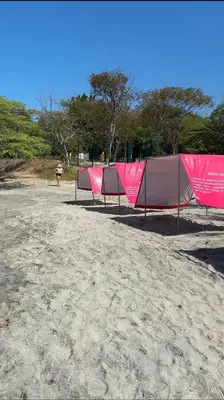 a group of tents sitting on the beach at Horizonte Infinito - Calidez frente al mar Santa Marta in Santa Marta