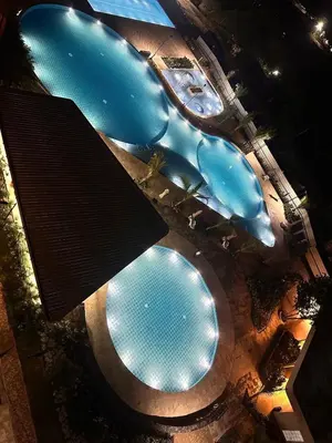an overhead view of two swimming pools in a building at New apartment on the 18th floor in Santa Marta with ocean views in Simón Bolivar