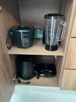 a shelf with a pot and a blender on it at Ocean Blue Apartment WiFI Beach Old Town in Cartagena de Indias