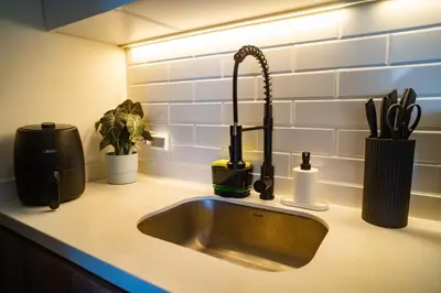 a kitchen sink with a faucet on a counter at Ocean Blue Apartment WiFI Beach Old Town in Cartagena de Indias