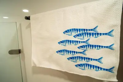 a group of blue fish on a white towel at Ocean Blue Apartment WiFI Beach Old Town in Cartagena de Indias