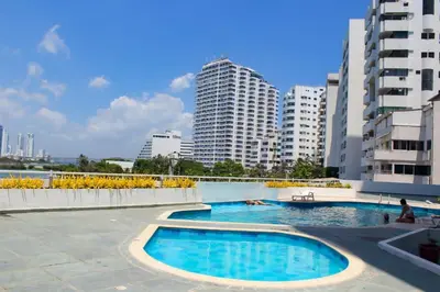 a swimming pool in a city with tall buildings at Vista al Mar desde tu balcón Torres del Lago Cartagena in Cartagena de Indias