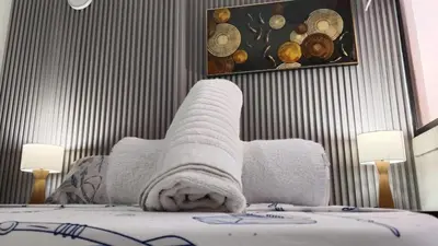 a hotel room with a bed with a towel on it at Apartamento Sol y mar Cartagena in Cartagena de Indias
