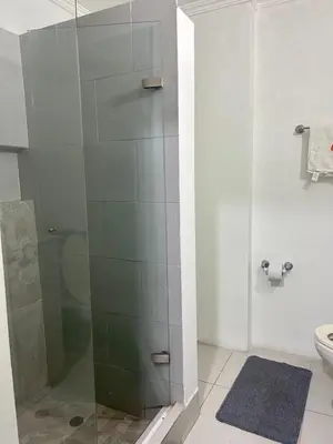 a bathroom with a shower with a glass door at Apartamento Sol y mar Cartagena in Cartagena de Indias