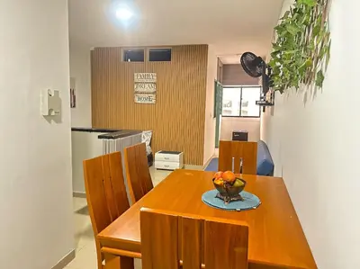 a dining room table with chairs and a bowl of fruit on it at Apartamento Sol y mar Cartagena in Cartagena de Indias