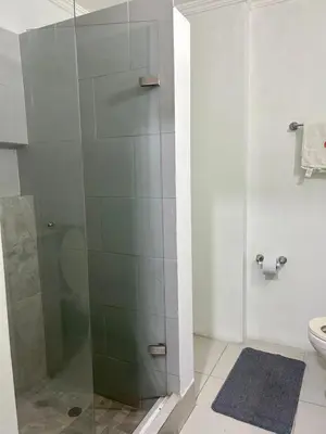 a bathroom with a shower with a glass door at Apartamento Sol y mar Cartagena in Cartagena de Indias
