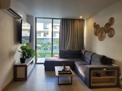 a living room with a couch and a large window at Apartamento in Morros Eos-Manzanillo del Mar in Cartagena de Indias
