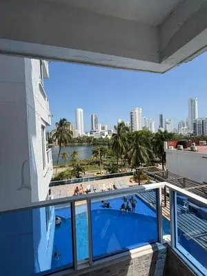 a view of a swimming pool from the balcony of a building at Lujoso Apartamento en Cartagena in Cartagena de Indias