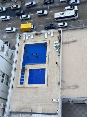 an overhead view of a swimming pool on the side of a building at Delfines De Bocagrande in Cartagena de Indias