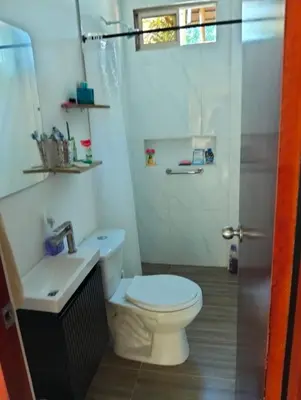 a bathroom with a toilet and a sink at Sandymar in San Bernardo del Viento