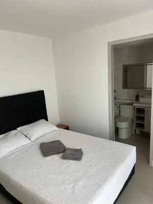 a bedroom with a bed with two towels on it at Spacious Flat with stunning Views Great Location in Cartagena de Indias